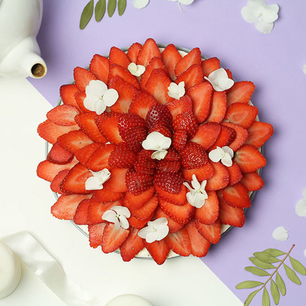 Cheesecake sans gluten aux fraises et à la fleur d'oranger